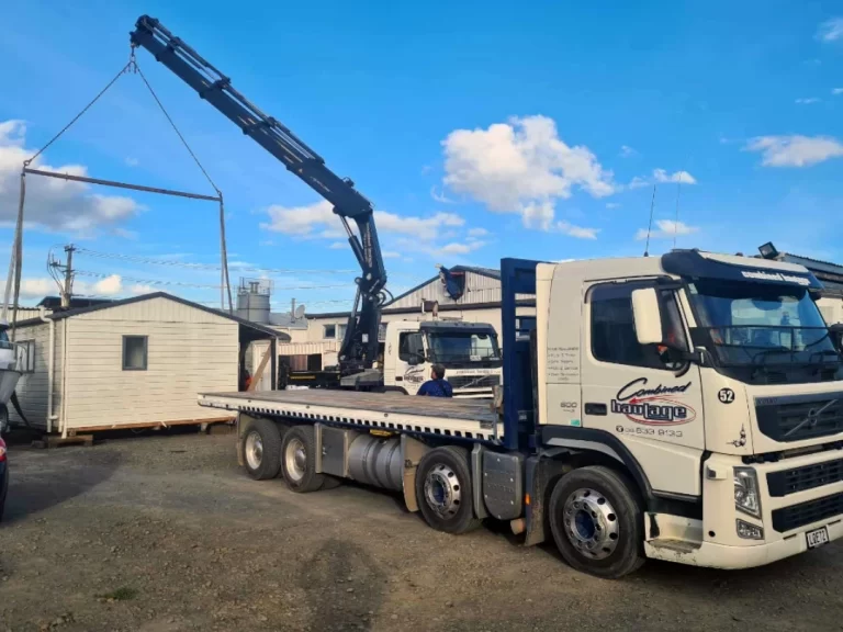 hiab hire truck lifting a house